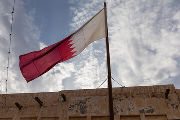 The Qatari flag flies in Souq Waqif, Qatar