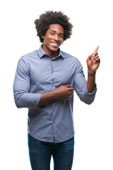 Afro american man over isolated background with a big smile on face, pointing with hand and finger to the side looking at the camera.