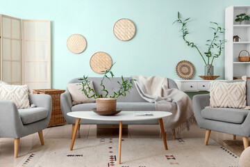 Interior of stylish living room with bamboo plant - obrazy, fototapety, plakaty