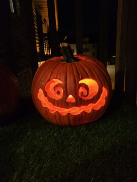 Jack O Lanter, carved pumpkin with candle inside; lit pumpkin, Halloween photography