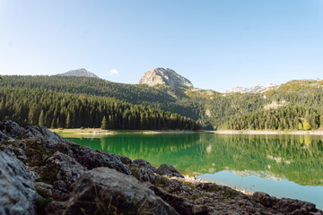 Beautiful view of the lake. Rocky shore of mountain lake in the morning. Travelling, lifestyle,...