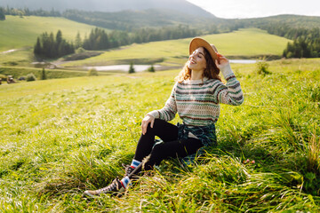 Happy Woman tourist admiring the landscape mountains nature. Travel, nature concept.