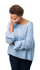 Young beautiful african american woman wearing a sweater over isolated background with sad expression covering face with hands while crying. Depression concept.