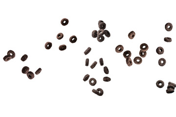 Chocolate rings cereal spill out into a bowl. Breakfast.