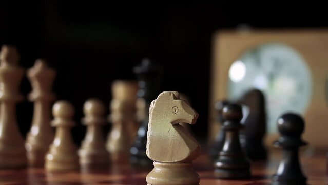 Chess White Knight Capture Black Pawn, Woman Playing Chess at Home. Close Up. 4K Resolution.