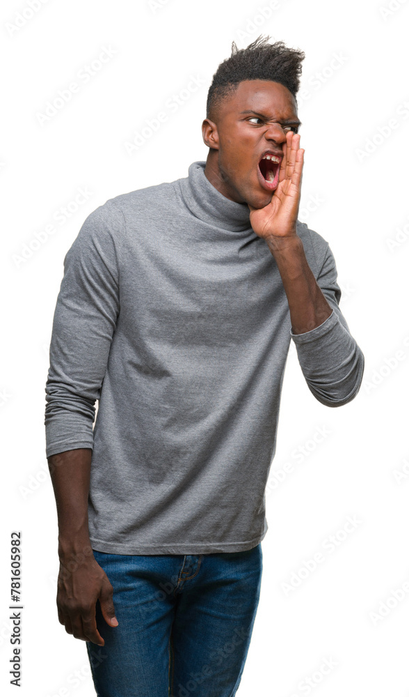 Sticker Young african american man over isolated background shouting and screaming loud to side with hand on mouth. Communication concept.