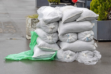 Stack of Sacks With Bulk Material Storage at Street