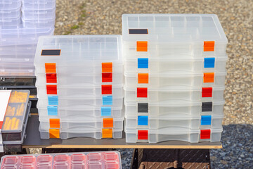 Stack of New Transparent Tackle Boxes Storage With Colour Coded Latches