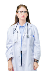 Middle age mature doctor woman wearing medical coat over isolated background puffing cheeks with funny face. Mouth inflated with air, crazy expression.