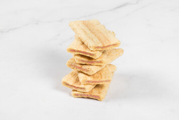 Vegan Crispy Corn oat rice bars strips with fruit and berry filling. In the section. Close-up. White background	