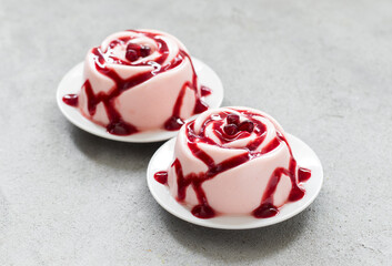 Pomegranate cream dessert, Panna Cotta in the shape of a rose. With pomegranate sauce. 