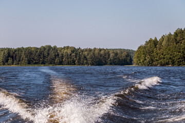 view from a motor boat of the water of Lake Ladoga and rocky islands. Ladoga skerries. Beautiful landscape	