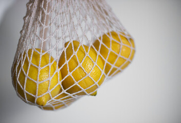 Lemons in a string bag
