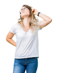 Fototapeta premium Beautiful young blonde woman wearing glasses over isolated background stretching back, tired and relaxed, sleepy and yawning for early morning