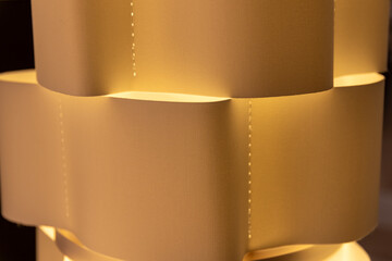 Artistic Paper Lamp with Elegant Curves Casting a Warm Glow