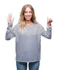 Fototapeta na wymiar Beautiful young blonde woman wearing stripes sweater over isolated background showing and pointing up with fingers number six while smiling confident and happy.