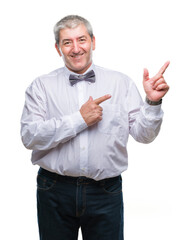 Handsome senior man wearing bow tie over isolated background smiling and looking at the camera...