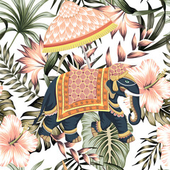 Indian elephant with umbrella, tropical palm leaves and pink flowers seamless pattern. Jungle vintage wallpaper	 - 781628318