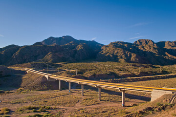 Bridge across a dry river near Potrerillos, in Mendoza, Argentina. Elevated view.