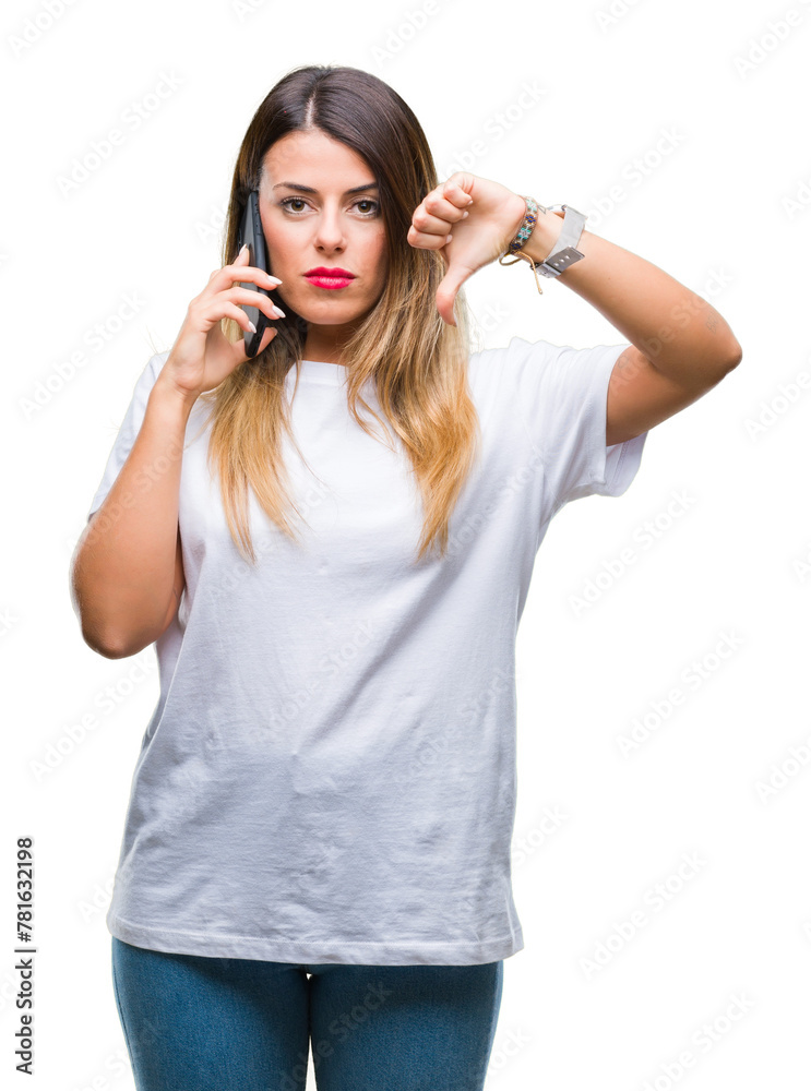 Canvas Prints Young beautiful woman speaking calling using smartphone over isolated background with angry face, negative sign showing dislike with thumbs down, rejection concept