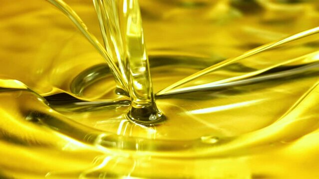 Super slow motion olive oil with splashes. High quality FullHD footage