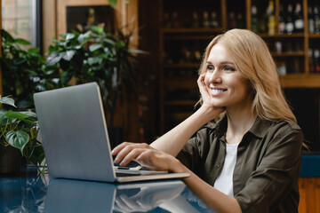 Young businesswoman student freelancer self-employed female working remotely on distance on laptop,...