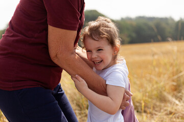 the beautiful connection between a little girl and her grandmother in the midst of nature,...