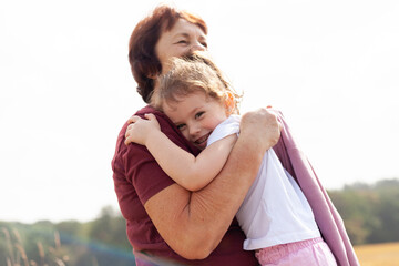 the warmth and love a little girl and her grandmother, surrounded by the beauty of nature and the peacefulness of the countryside