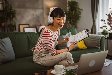 Japanese woman hold document contract work at home