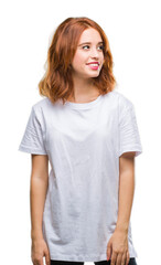 Fototapeta premium Young beautiful woman over isolated background looking away to side with smile on face, natural expression. Laughing confident.