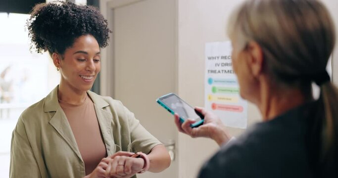 Women, smart watch and payment with machine for pos with customer at pharmacy for healthcare services. People, easy transaction and banking at point of sale with smile, fintech and discount at clinic