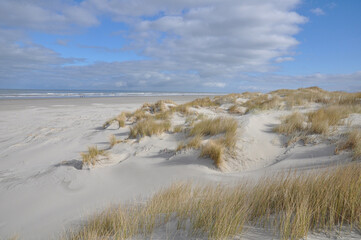 Fototapeta na wymiar Schiermonnikoog ,The Netherlands.Island in the Waddenzee. Emptiness, dunes ,beach,clouds and sea 