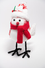 handcrafted bird Christmas holiday yule decorations wearing scarf winter white background 