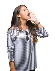 Fototapeta premium Young beautiful arab woman wearing sunglasses over isolated background shouting and screaming loud to side with hand on mouth. Communication concept.
