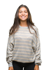 Young beautiful arab woman wearing winter sweater over isolated background with a happy and cool...
