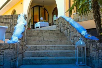 wedding venue entrance decorated with blue tulle and elegant lantern