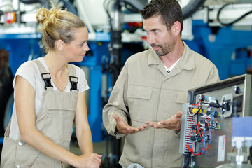 male and female mechanics in discussion