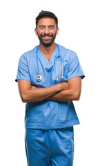 Adult hispanic doctor or surgeon man over isolated background happy face smiling with crossed arms...