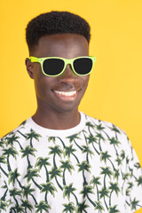A man with a green pair of sunglasses on his face