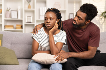 Concerned Man Comforting Upset Woman On Couch In Cozy Living Room. Support, Relationship Issues, Empathy.