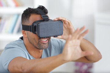 handsome man in a virtual reality mask - obrazy, fototapety, plakaty
