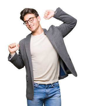Young business man wearing glasses over isolated background stretching back, tired and relaxed, sleepy and yawning for early morning