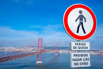 Road sign prohibiting pedestrian movement and danger of falling caption with the background. Road...