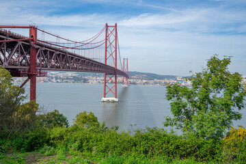 25 de Abril bridge, or Salazar bridge seen from Almada to Lisbon-Portugal.