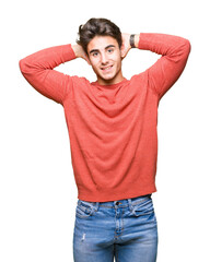 Young handsome man over isolated background Relaxing and stretching with arms and hands behind head and neck, smiling happy