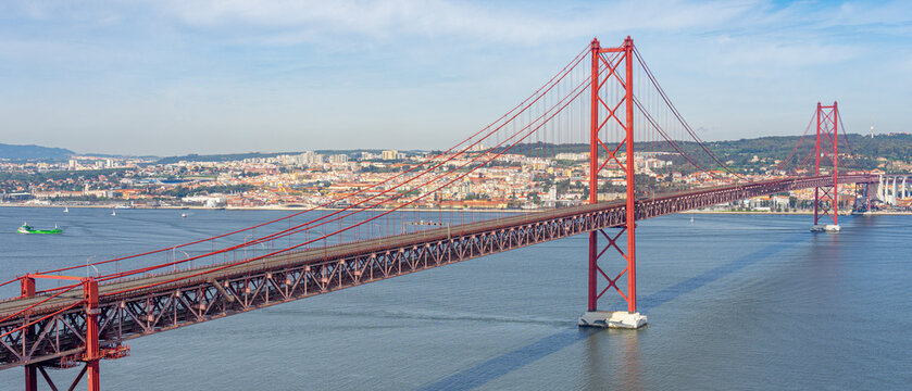 25 de Abril bridge, or Salazar bridge seen from Almada to Lisbon-Portugal.