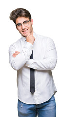 Young business man wearing glasses over isolated background looking confident at the camera with smile with crossed arms and hand raised on chin. Thinking positive.