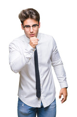 Young business man wearing glasses over isolated background feeling unwell and coughing as symptom for cold or bronchitis. Healthcare concept.