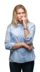 Young caucasian business woman over isolated background looking stressed and nervous with hands on mouth biting nails. Anxiety problem.