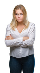 Young caucasian woman over isolated background skeptic and nervous, disapproving expression on face with crossed arms. Negative person.